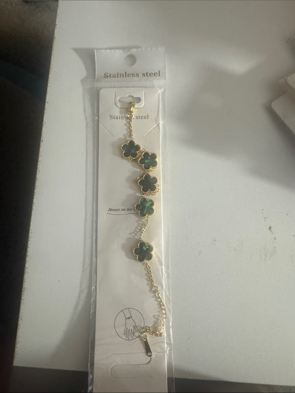 Gold Stainless Steel Bracelet with Green Clover Accents